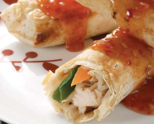 Three-chicken-and-vegetable-rolls-wrapped-in-Mountain-Bread-covered-in-sweet-chilli-sauce.