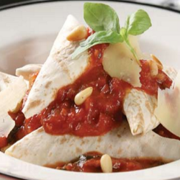 Mountain-bread-ravioli-with-roast-pine-nuts-tossed-in-a-tomato-sauce.