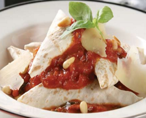 Mountain-bread-ravioli-with-roast-pine-nuts-tossed-in-a-tomato-sauce.