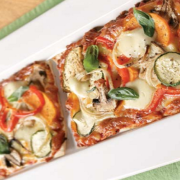 vegetarian-pizza-with-eggplant-zucchini-and-capsicum-topped-with-fresh-basil.