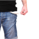 man in jeans torso showing his empty pockets